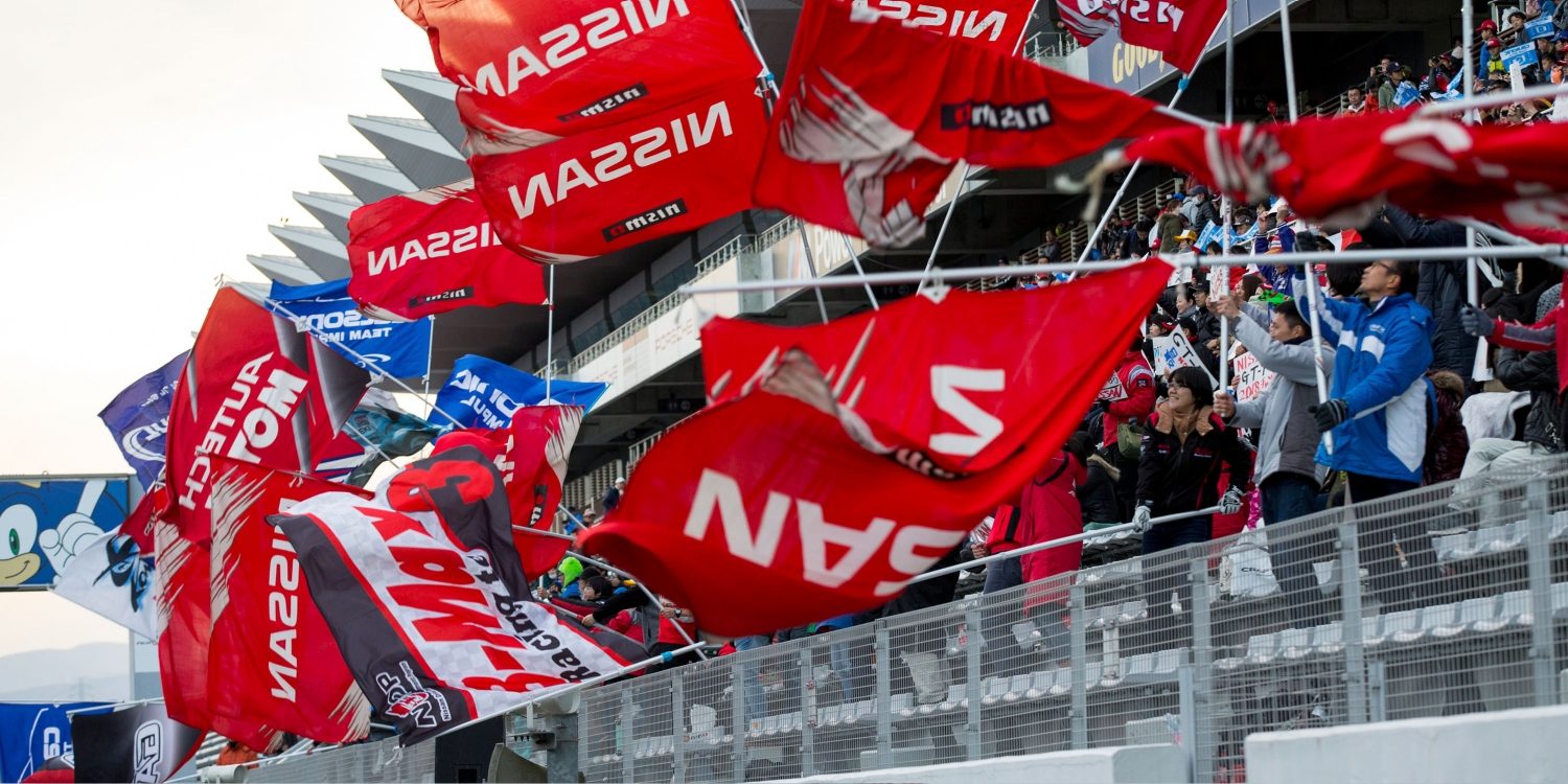 Nissan flags waving from the stands