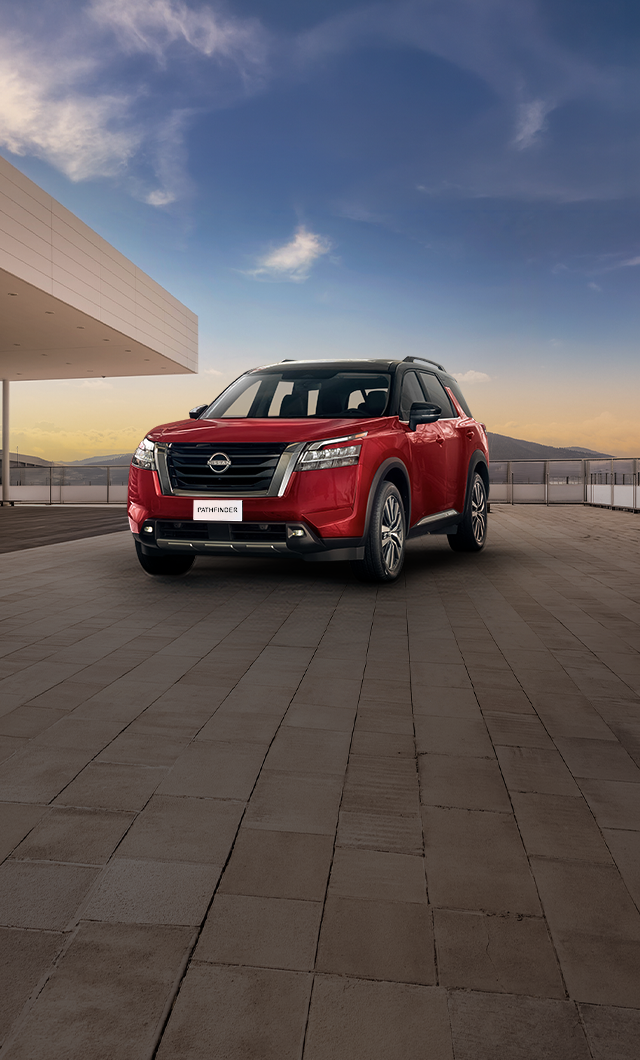 Nissan Pathfinder with festive night backdrop.