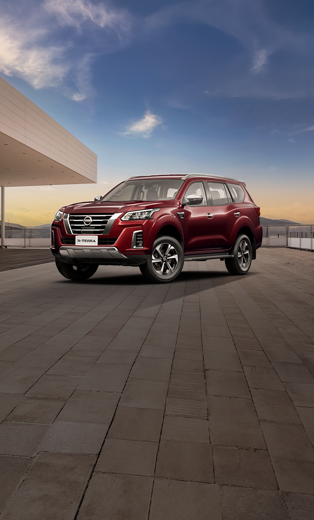 Nissan X-Terra with festive night backdrop.